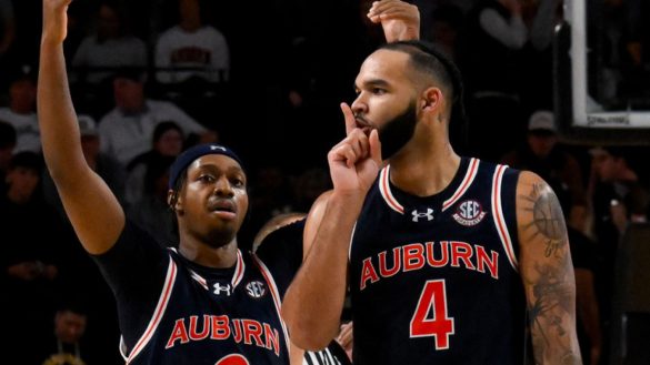 Feb 11, 2025; Nashville, Tennessee, USA; Auburn Tigers forward Johni Broome (4) gestures to the Vanderbilt Commodores student section after Vanderbilt Commodores calls time out during the second half at Memorial Gymnasium. Mandatory Credit: Steve Roberts-Imagn Images